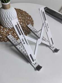 1 个白色便携式笔记本电脑支架，可折叠和可调节塑料笔记本电脑支架（订购前请注意尺寸，大号和小号。） - 彩色 - 查看 12