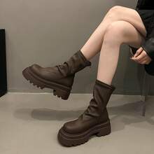 Botas femininas até o joelho