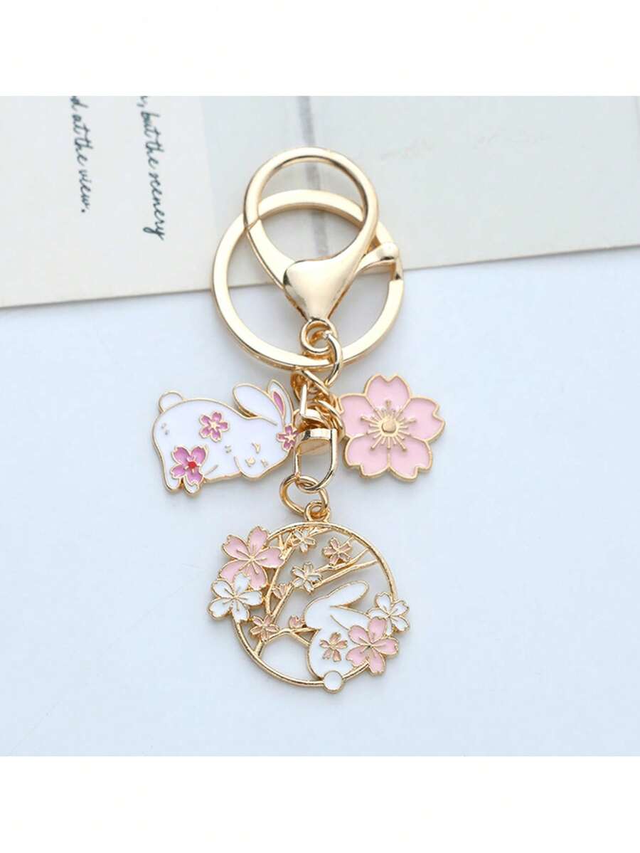 1 pieza Llavero con conejo de flor de cerezo rosa, llavero colgante de conejo de flor de cerezo de estilo japonés de dibujos animados, decoración de bolso/llave de coche de moda, regalo ideal para mujeres - Rosa - Ver 1