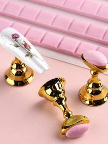 80件套粉色系列美甲工具套装，包含48格可重复使用的美甲泥、10个美甲支架+2个透明底座、15支美甲笔+5支点钻笔，可用于展示和练习美甲贴纸，磁性假指甲支架方便专业美甲练习，套装内含美甲胶水和假指甲，适合DIY新手和家庭美甲沙龙使用，是送给女性的绝佳圣诞礼物。