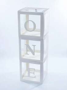 适合男孩或女孩的一周岁生日装饰套装，包含3个“ONE”字样气球、透明积木拼成的“ONE TWO THREE”字母，可用作拍照道具和蛋糕背景。不含气球。 - 白色 - 查看 6