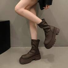 Botas femininas até o joelho