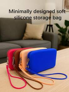 1个长形硅胶材质零钱包，多功能大容量收纳包，带绳化妆包，简约小物品数码收纳包，便携式零钱包，月经包，耳机包，柔软硅胶触感舒适，适合居家、工作、外出、旅行。