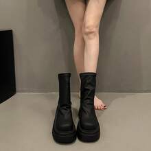 Botas femininas até o joelho