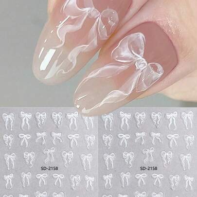 2片可爱白色蝴蝶结丝带设计，轻薄耐用，3D美甲贴纸，自粘式浪漫婚礼蝴蝶结贴花，DIY美甲装饰。贴在指甲上，涂一层透明指甲油或亮面封层，让美甲更持久美丽。