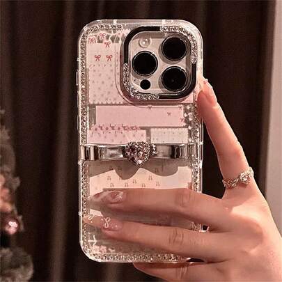 奢华闪亮水钻时尚手机壳，趣味卡通全屏激光猫咪图案，搭配心形宝石蝴蝶结，兼容 17 Pro Max、16 Pro Max、15 Pro Max、14 Pro Max、13 Pro Max、12 Pro Max、17 Pro、16 Pro、15 Pro、14 Pro、13 Pro、12 Pro、16、15、14、12、13、11等机型，柔软防震后盖，春季派对礼物之选