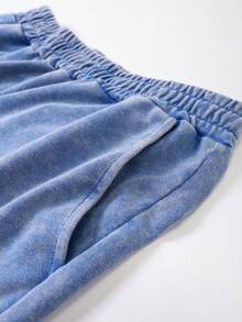 夏季男士休闲运动套装，包含宽松短袖T恤（做旧雪水效果）和松紧腰抽绳短裤，适合街头、户外、徒步、海滩等场合。 - 藍色 - 查看 7