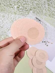 50 قطعة شريط حلمة غير مرئي، وسادات حلمة قابلة للتخلص منها، ملصقات حلمة غير منسوجة، ملصقات صدر، أغطية حلمة قابلة للتخلص منها، حمالة صدر غير مرئية قابلة للتنفس وذاتية اللصق، إكسسوارات ملابس داخلية ونساء - لون مشمشي - مشاهدة 9