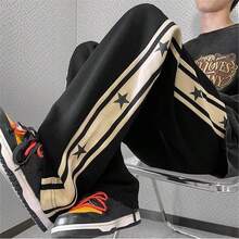 Pantalones de hombre con diseño de patrón de stars y ribete de contraste, estilo holgado tipo paracaídas y largo, color negro liso para salir - Negro - Ver 4