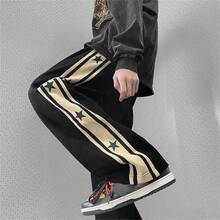 Pantalones de hombre con diseño de patrón de stars y ribete de contraste, estilo holgado tipo paracaídas y largo, color negro liso para salir - Negro - Ver 3