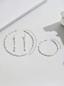 1 Set de joyas de 3 piezas con collar, pulsera y aretes con cristal azul de strass con diseño ondulado