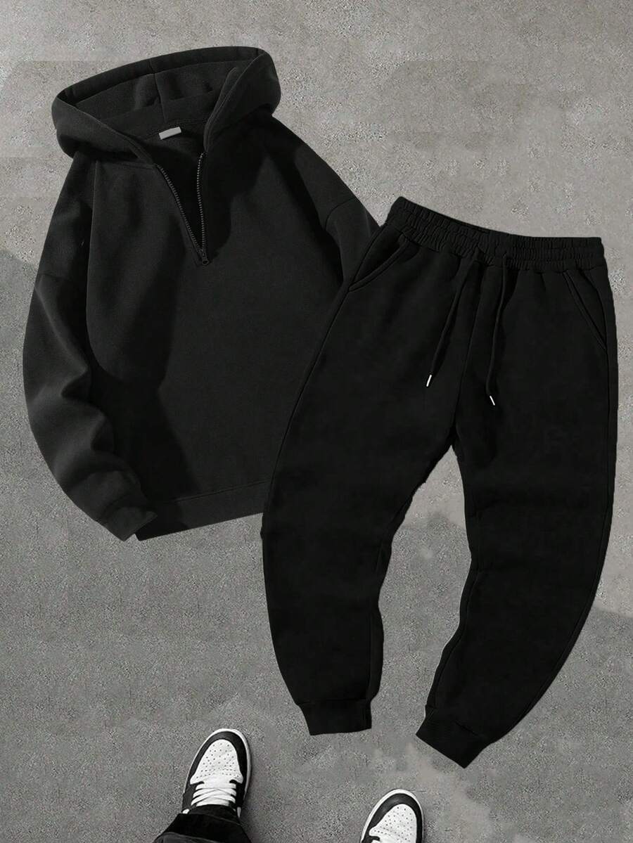 (Autunno/Inverno) Set tuta da uomo, composto da felpa con cappuccio e mezza chiusura lampo, coulisse in vita, pantaloni 3/4 tinta unita. Completo sportivo alla moda, felpa con cappuccio adatta per corsa, allenamento, stile casual boyfriend. Outfit comodo.