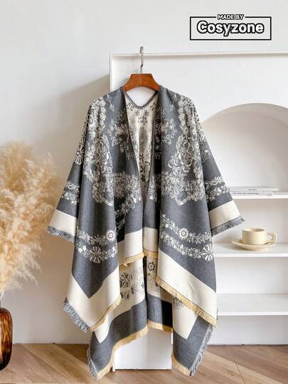 一件优雅花卉提花加厚开襟斗篷披肩，保暖防风，女士时尚百搭，适合秋冬季节，适合外出、旅行、摄影等场合。