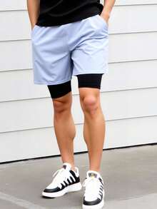 Short deportivo con licra corta interior. Ideal para entrenamientos intensos, brinda soporte y comodidad. Tejido ligero, transpirable y de secado rápido. Diseño atlético y moderno. Ideal para el uso del gimnasio, fitness y uso diario. - Gris Claro - Ver 1