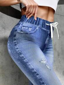 Damskie legginsy sportowe z nadrukiem imitującym dżins, ściągane sznurkiem, przyjazne dla skóry i oddychające, z wysokim stanem i podnoszące biodra. Można je nosić o każdej porze roku, nadają się do ćwiczeń na świeżym powietrzu, jogi i codziennego noszenia.