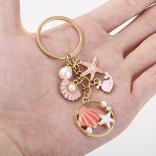 1 pièce Porte-clés style océan doré, pendentif de breloque coquillage, étoile de mer, hippocampe, fausse perle. Accessoire de voiture, de sac, breloque scolaire, fausse perle, gothique mignon Y2K