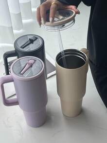 كوب فولاذي مقاوم للصدأ سعة 40 أونصة مع غطاء قش، مقبض مانع للانزلاق وحامل كوب للسيارة - احتفاظ بالثلج لمدة 34 ساعة، كوب سفر محكم الإغلاق للجيم والعمل والسيارة