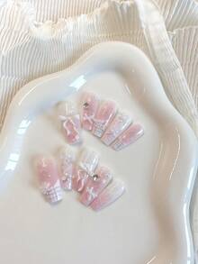 Summer Nail Art With A Fresh And Sweet Girlish Style - 10 Medium-Length Coffin-Shaped Pressed Fake Nails. The Girl'S Pastel Color Serves As The Base Color, With A Gradient Of Shiny And Glittering Details. Hand-Painted French Checkered Silver Lines Are Paired With White Bows And Five-Pointed Star Rhinestones Nail Supplies Nails Handmade Press On Nails - Baby Pink - View 4