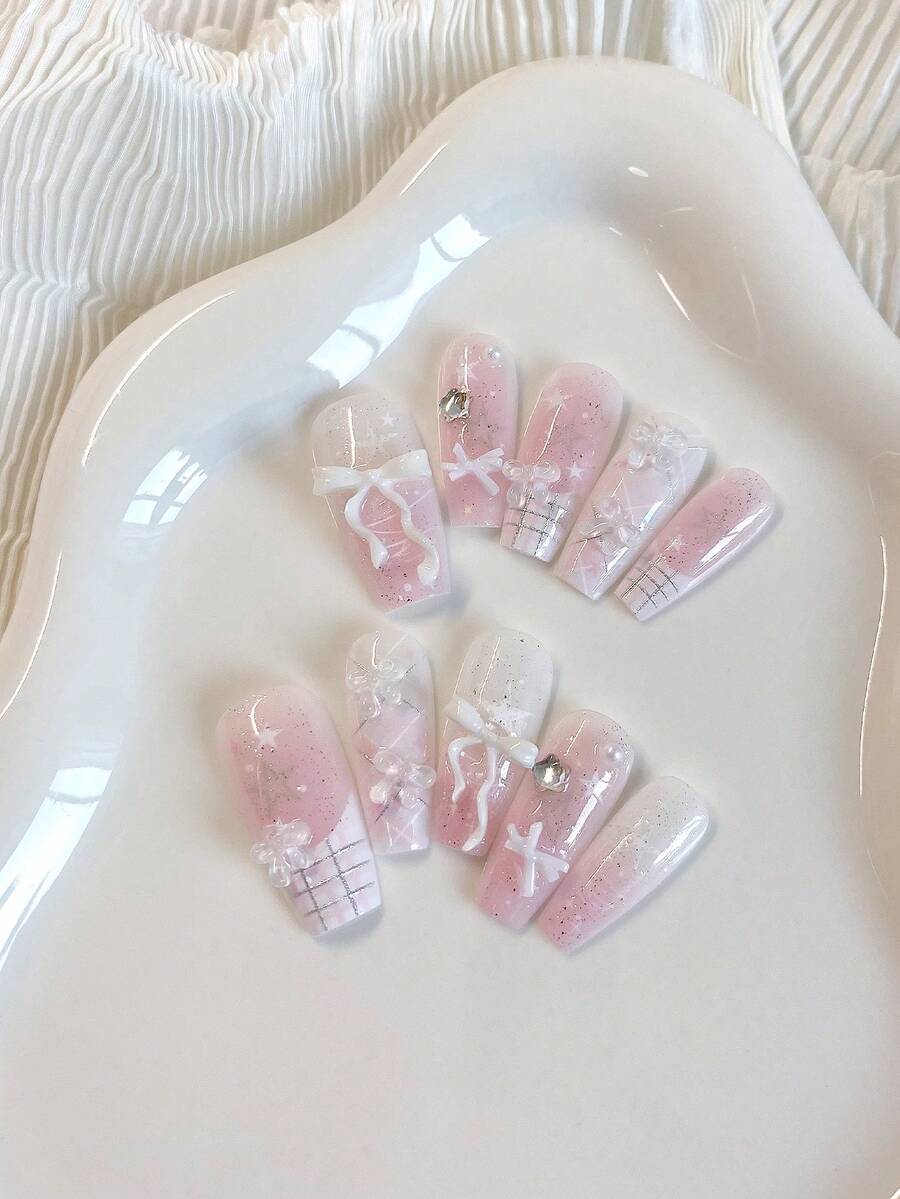 Summer Nail Art With A Fresh And Sweet Girlish Style - 10 Medium-Length Coffin-Shaped Pressed Fake Nails. The Girl'S Pastel Color Serves As The Base Color, With A Gradient Of Shiny And Glittering Details. Hand-Painted French Checkered Silver Lines Are Paired With White Bows And Five-Pointed Star Rhinestones Nail Supplies Nails Handmade Press On Nails - Baby Pink - View 1