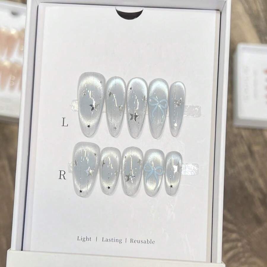 OroBelle 2025 Blue Cat Eye & Watercolor Press-On Nails| Long Oval Shape| With Starry Glitter, Holographic Flows & Bow Details| Icy Blue Glass Pearl Nail Art - S - Xem 1