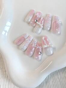 Summer Nail Art With A Fresh And Sweet Girlish Style - 10 Medium-Length Coffin-Shaped Pressed Fake Nails. The Girl'S Pastel Color Serves As The Base Color, With A Gradient Of Shiny And Glittering Details. Hand-Painted French Checkered Silver Lines Are Paired With White Bows And Five-Pointed Star Rhinestones Nail Supplies Nails Handmade Press On Nails - Baby Pink - View 5