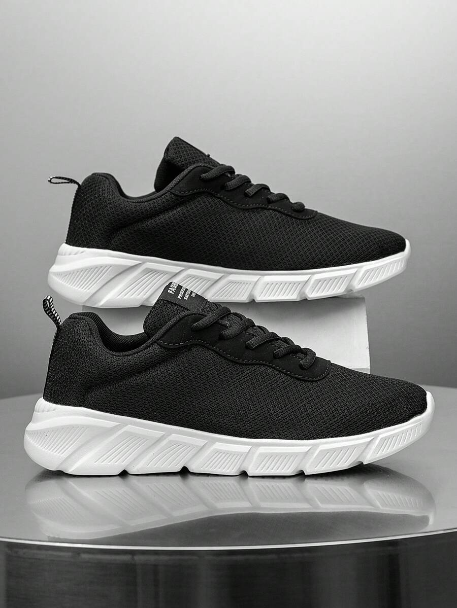 Giày thể thao nam buộc dây lưới phối màu đen trắng thời trang, nhẹ và thoải mái, giày sneaker thể thao đa năng cho các hoạt động ngoài trời quanh năm.