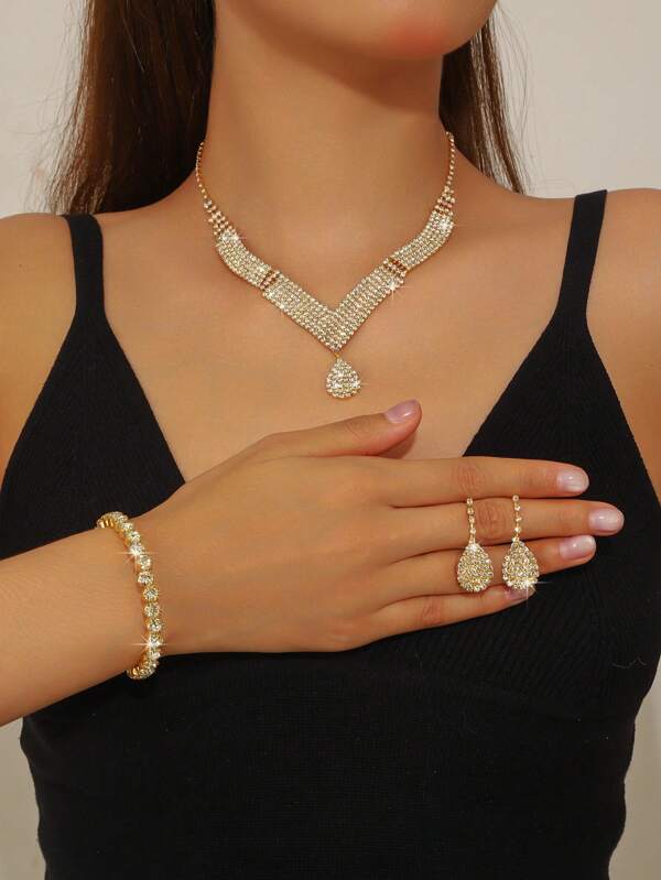 1 set d'élégants et élégants bijoux tout en strass, comprenant des boucles d'oreilles, colliers et bracelets, pour les cadeaux de mariage/fête/festivités des femmes