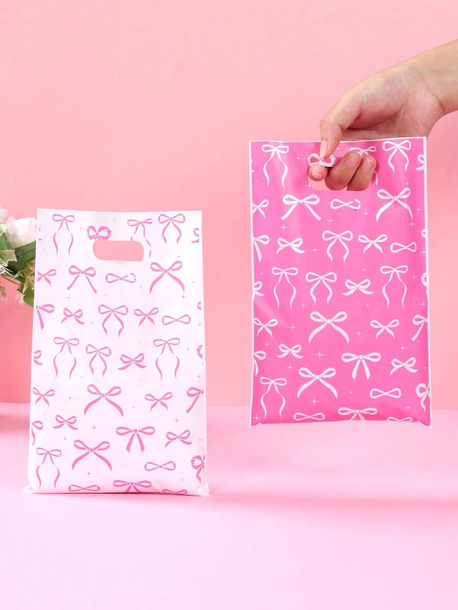 10/25/50个装粉白蝴蝶结礼品袋，蝴蝶结礼品包装袋，手提袋，礼品包装袋，收纳袋，派对回礼袋，一周岁生日派对装饰，生日派对用品，婚礼用品，新娘送礼会回礼，婴儿派对装饰，性别揭晓派对装饰，节日派对用品