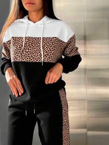 Conjunto de pants afelpado, deportivo y casual para mujer, tela de poliéster y spandex, ideal para temporadas de otoño e invierno, sudadera con bolsillo de canguro y capucha, pantalón semi-entubado, con resorte en la bota, ajuste de cintura natural con resorte y cordón para mayor ajuste, con bolsillos frontales funcionales. - Negro - Ver 1