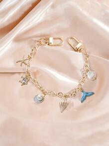 Ozean Charm, Ozean Taschencharm, goldfarbener Ozean Stil Taschencharm, dekorativer Zubehör, dekorative Taschenkette, Taschenverlängerung, Ersatzkette mit Charm, geeignet für Handtaschen, Shopper, Umhängetaschen, Schultertaschen, goldfarbener Ozean Stil Schlüsselanhänger mit Fischschwanz und Seestern Charm - elegantes Golddesign, modisches Taschenausstattung | Stranddekoration | Druckknopf