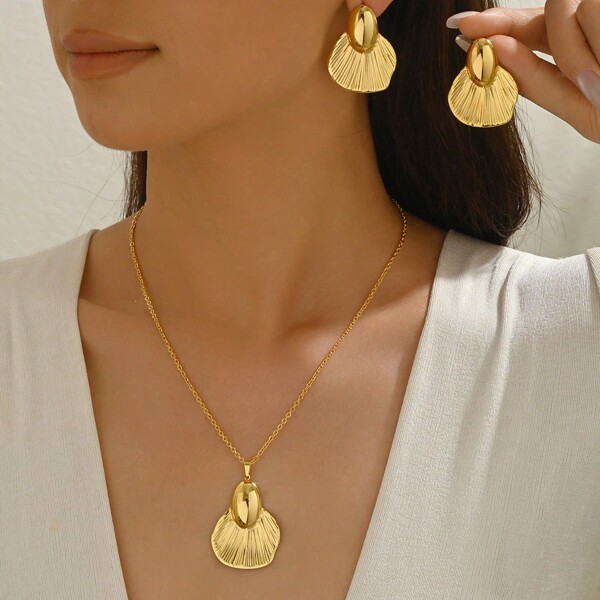 Conjunto de joyería asimétrica con flor y corazón geométricos, collar y aretes