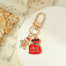 Weihnachts-Schlüsselanhänger aus Metall – Lebkuchenmann mit Englisch