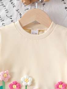 Conjunto de blusa de manga larga con estampado floral lindo y pantalón acampanado para niñas