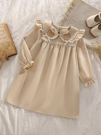 少女优雅时尚百搭可爱小熊贴花喇叭袖拼接荷叶边下摆长袖中长连衣裙，适合上学、外出和玩耍，秋冬季穿着。