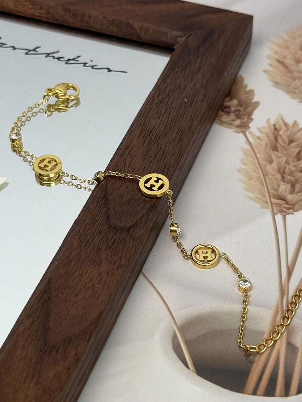 1 pièce Bracelet en acier inoxydable de luxe haute gamme électrolytique 18 carats simple avec lettre H en strass, polyvalent et résistant à la décoloration