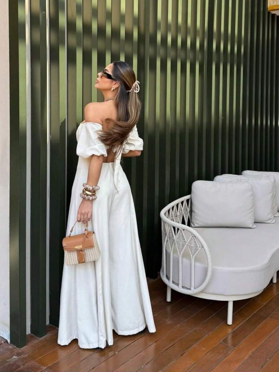 The Look That Exudes Tropical Elegance With Attitude! The Itacaré Jumpsuit Is Pure Charm For Stylish Summer Days. It Features Puff Sleeves And An Off-The-Shoulder Neckline. A Tie Detail At The Back Enhances The Silhouette. Comfort And Visual Impact In A Single Piece. Ideal For Your Clients Who Love To Stand Out With Style And Personality! - 白色 - 查看 1