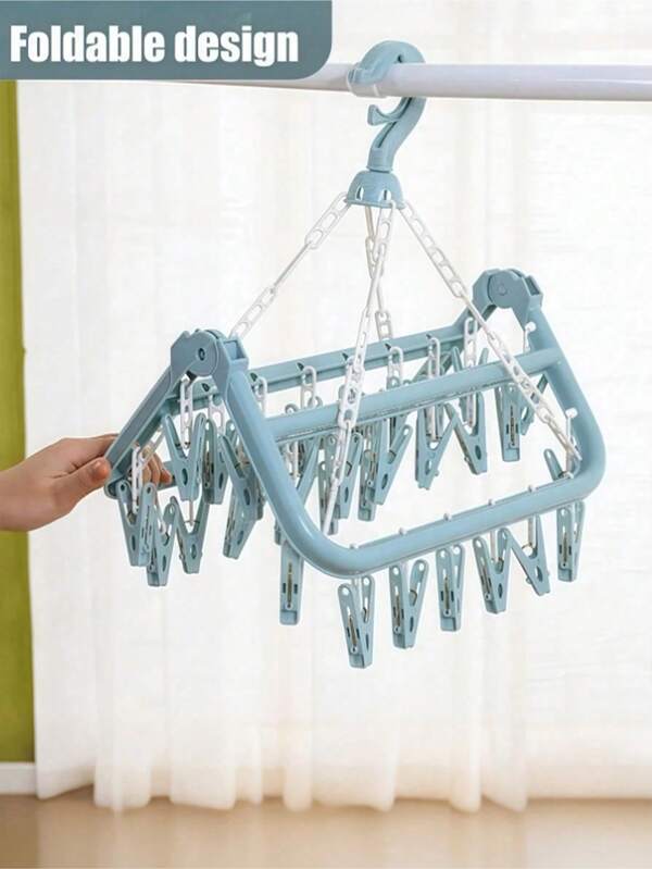 1 pieza Percha de plástico con 32 pinzas, con gancho, plegable y antigoteo, adecuada para colgar ropa, ropa interior, calcetines y tallas grandes, no apta para abrigos, vestidos, pantalones, zapatos, vaqueros, faldas gruesas, blusas de primavera y verano, diseño ergonómico, artículo esencial para el almacenamiento en el hogar/baño/dormitorio, estante organizador multifuncional, estilo minimalista, imprescindible para apartamentos, secadora de uso múltiple (color/estilo aleatorio)