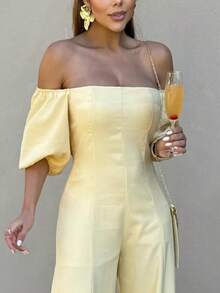 The Look That Exudes Tropical Elegance With Attitude! The Itacaré Jumpsuit Is Pure Charm For Stylish Summer Days. It Features Puff Sleeves And An Off-The-Shoulder Neckline. A Tie Detail At The Back Enhances The Silhouette. Comfort And Visual Impact In A Single Piece. - 黃色 - 查看 2
