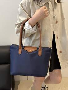 一款简约百搭的纯色休闲手提包，容量大，带拉链，可作为单肩包使用，适合购物、度假、工作、通勤以及各种场合。 - 藍色 - 查看 4