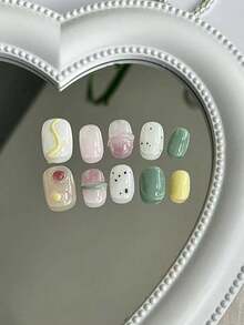 10 piezas de uñas postizas - Diseño de degradado de dibujos animados lindos, macarrón, desnudo, caramelo, uñas falsas cortas ovaladas con acabado brillante y decoraciones de pegamento para uso diario y fiestas festivas - Suministros de arte de uñas para mujeres y accesorios de fiesta