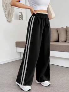 Pantalón de mujer unicolor cómodo para uso casual con rayas laterales de encaje - Negro - Ver 1