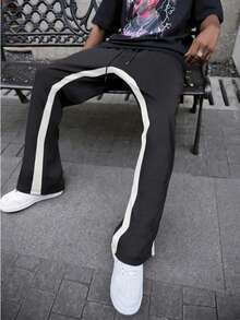 Pantalones sanitarios modernos y modernos para hombre con estampado de contraste de color y patrón de llamas, pantalones para hombre con diseño de contraste de color con cordón, tela de poliéster transpirable y antitranspirante, con bolsillos y cintura elástica, estilo callejero underground, patineta, hip-hop y rap. - Negro - Ver 3