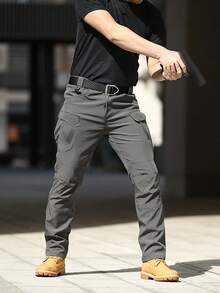 Pantalones tácticos multibolsillos para hombre están hechos de tela duradera y resistente al agua y cuentan con bolsillos laterales y cremalleras. - Gris - Ver 2