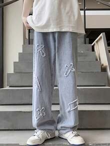 Pantalones vaqueros holgados para hombre con bordado de relámpago y patrón de cruz desgastado.