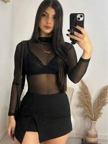 ✨ ¡BLUSA MESH UNITALLA DISPONIBLE YA! ✨  Dale un toque atrevido y con estilo a tu outfit con esta blusa mesh súper versátil  Perfecta para looks de noche, festivales o para elevar cualquier conjunto con un toque moderno y sexy - Negro - Ver 2