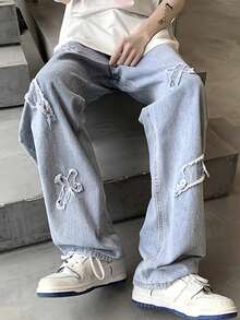 Pantalones vaqueros holgados para hombre con bordado de relámpago y patrón de cruz desgastado.