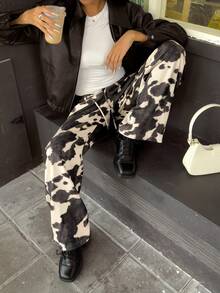 休闲复古牛皮印花裤