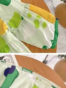 YUXIN 夏季必备！女士清新水果印花灯笼袖宽松上衣。单排扣设计增添细节感。褶皱泡泡袖款式超级可爱。适合日常出行和度假野餐。透气面料让您整个夏天都保持凉爽！