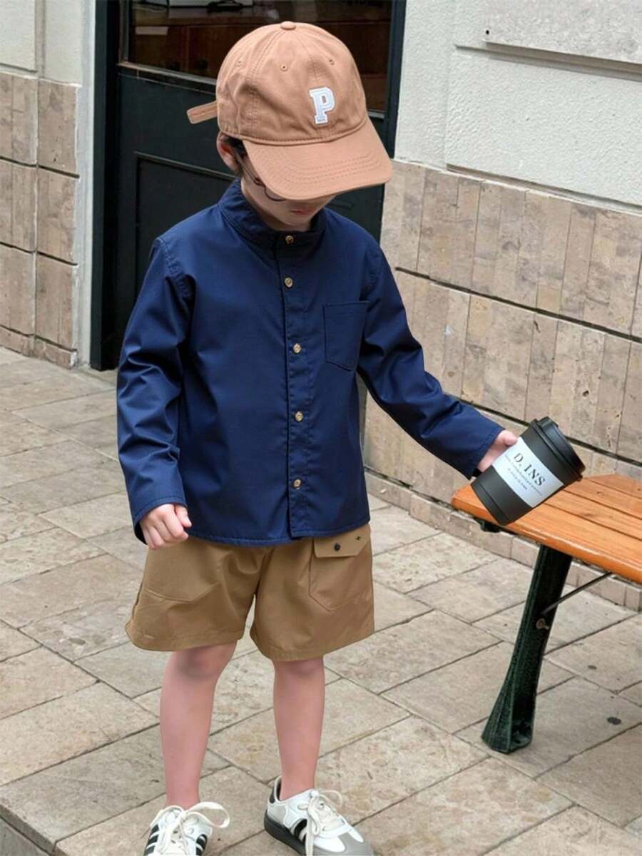 CAMISA PARA NIÑO CUELLO MAO , CON MANGA LARGA BOTONES AL FRENTE ,BOLSA EN EL COSTADO - Azul Marino - Ver 1