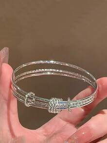 Bransoletka z wisiorkiem w kształcie liścia z posrebrzanej miedzi, minimalistyczny, wielowarstwowy design, młodzieżowy styl